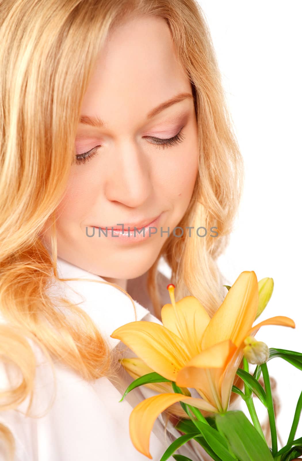 beautiful young woman with lily flower, close-up portrait