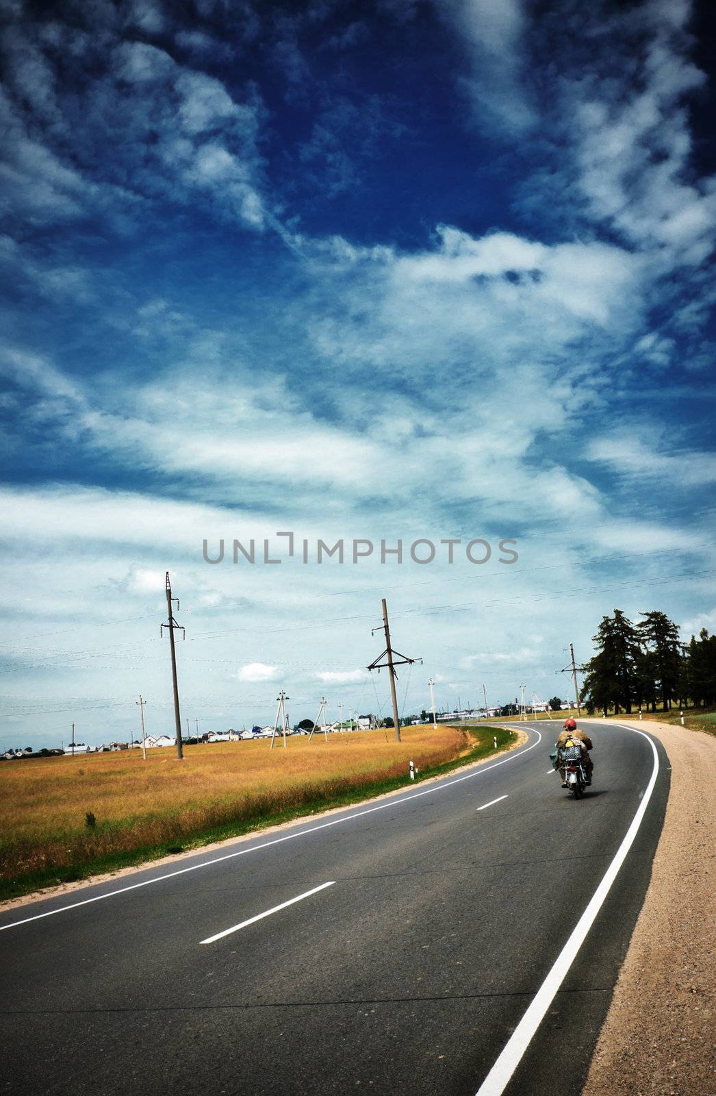 highway with motorcycle under blue sky at summer
