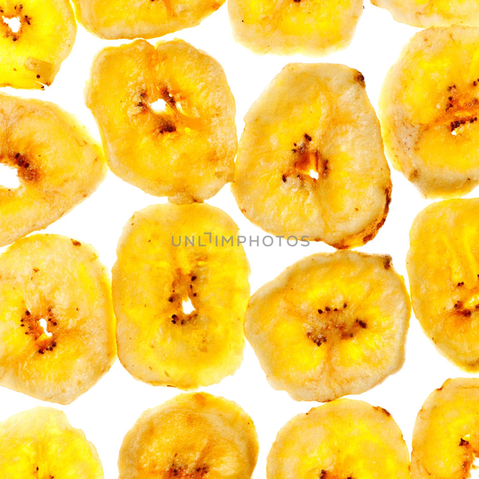 dried banana yellow sliced chips, square background
