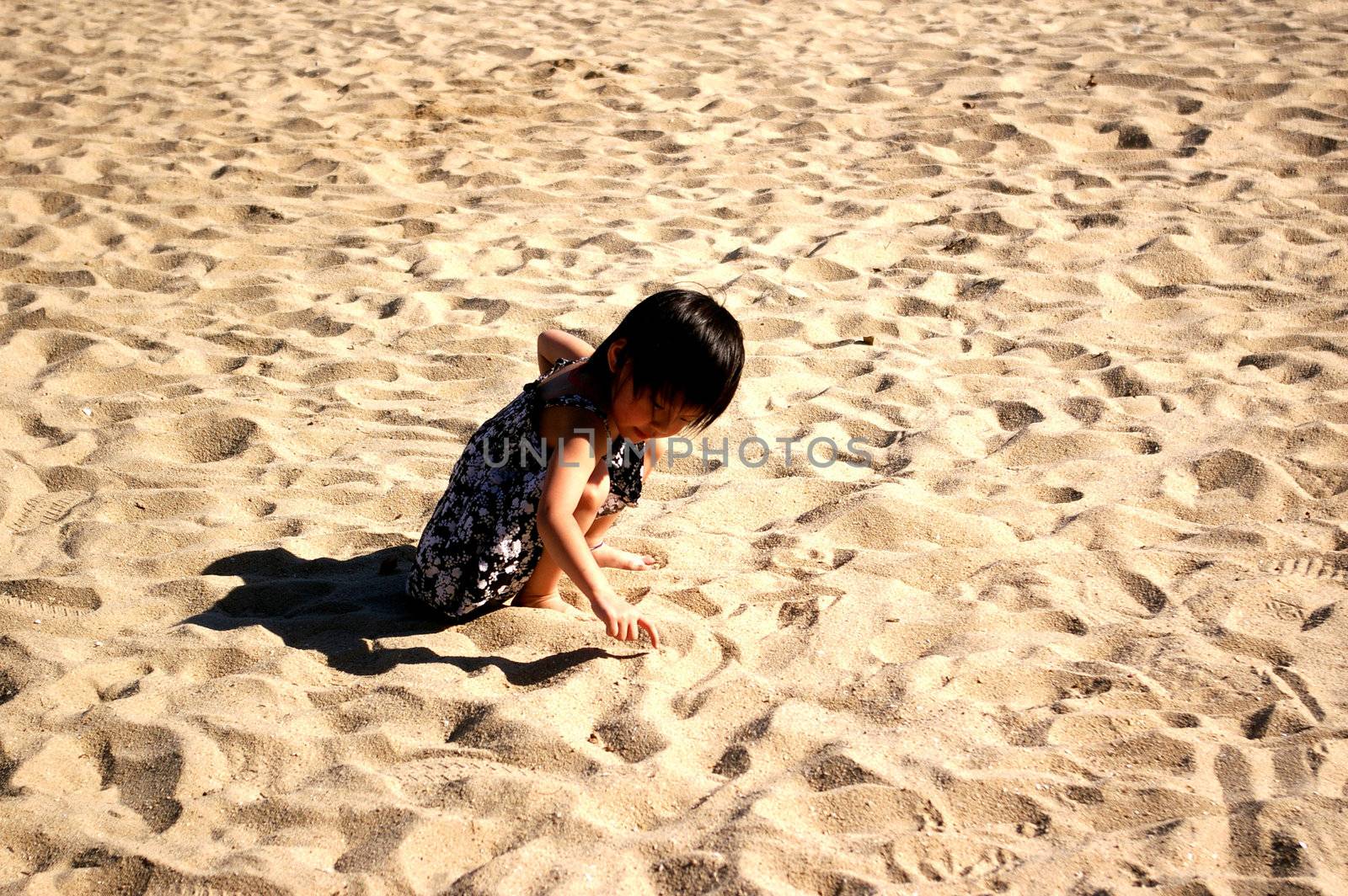 Young and cute Chinese girl playing sand by kawing921