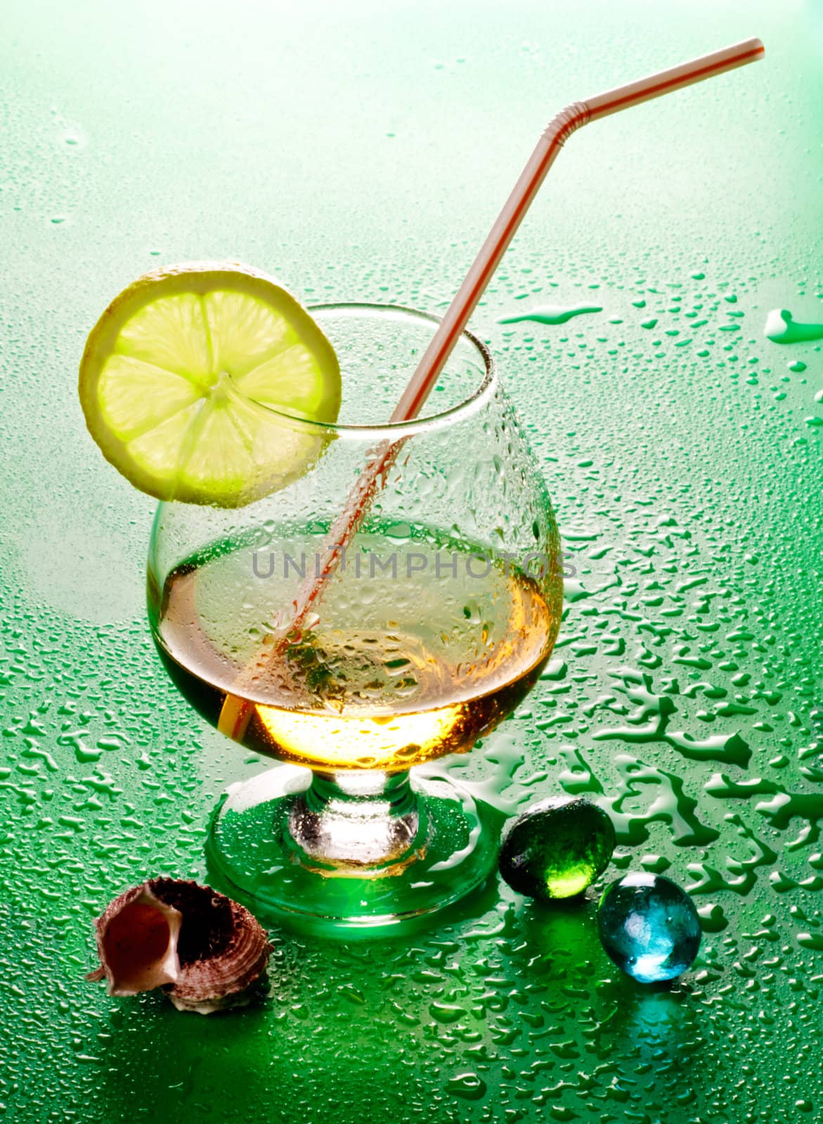 cocktail in glass with slice of lime