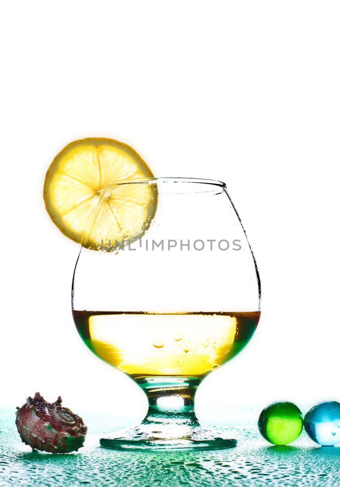 cocktail in glass with slice of lime