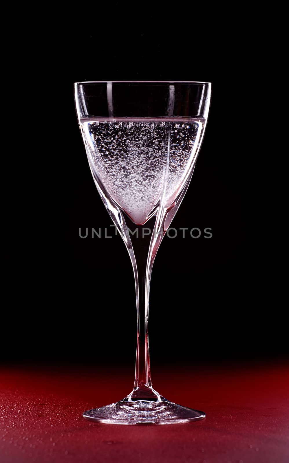 mineral water glass isolated on black background