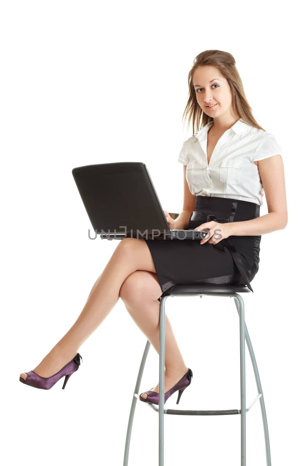 young businesswoman sitting on chair with laptop, isolated on white