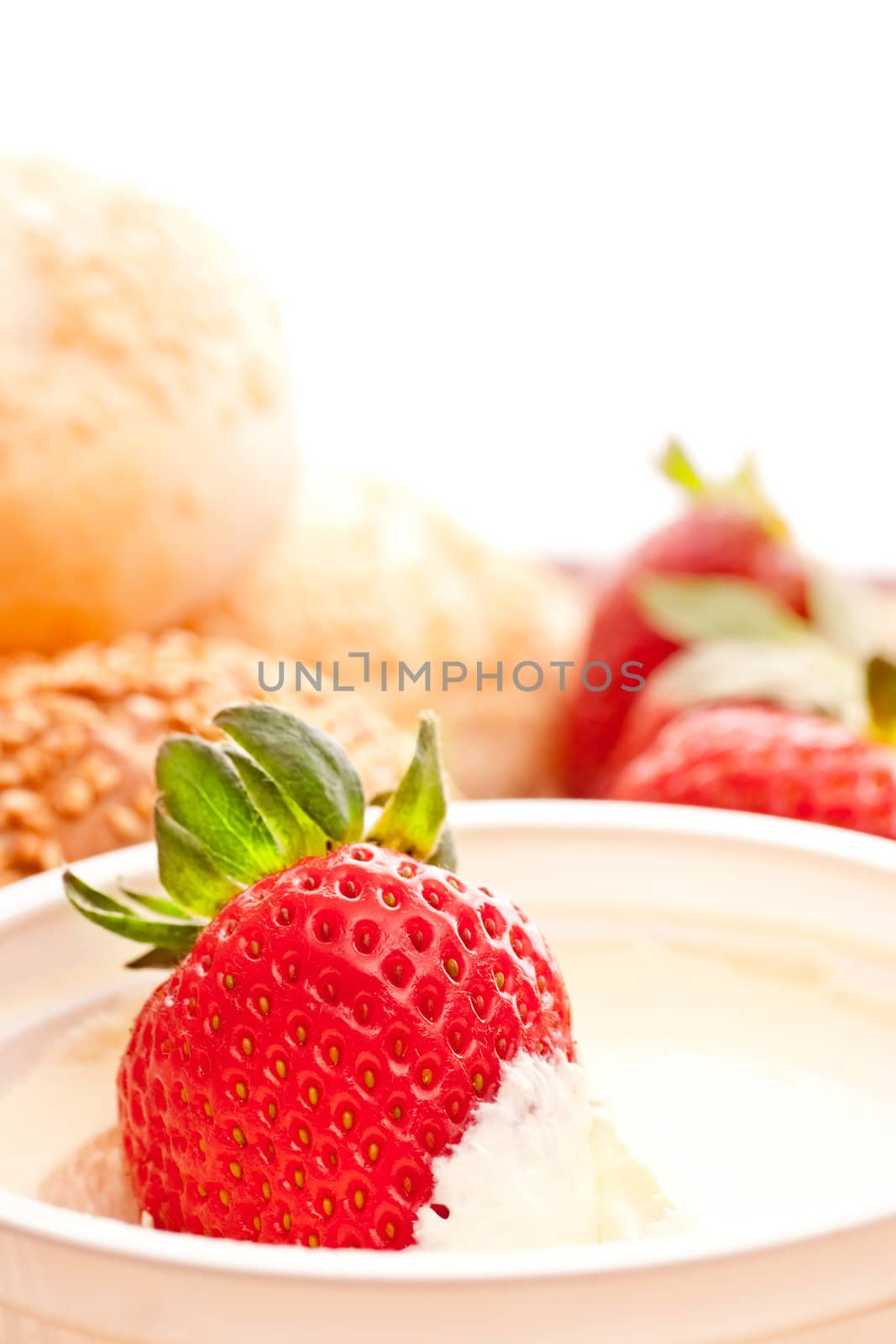 fresh strawberry in sour cream, close up