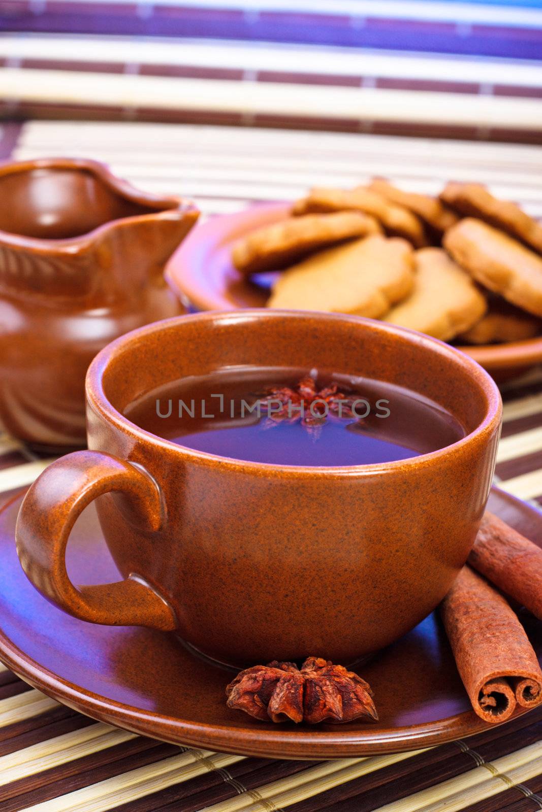 winter tea with cinnamon and star anise on bamboo napkin