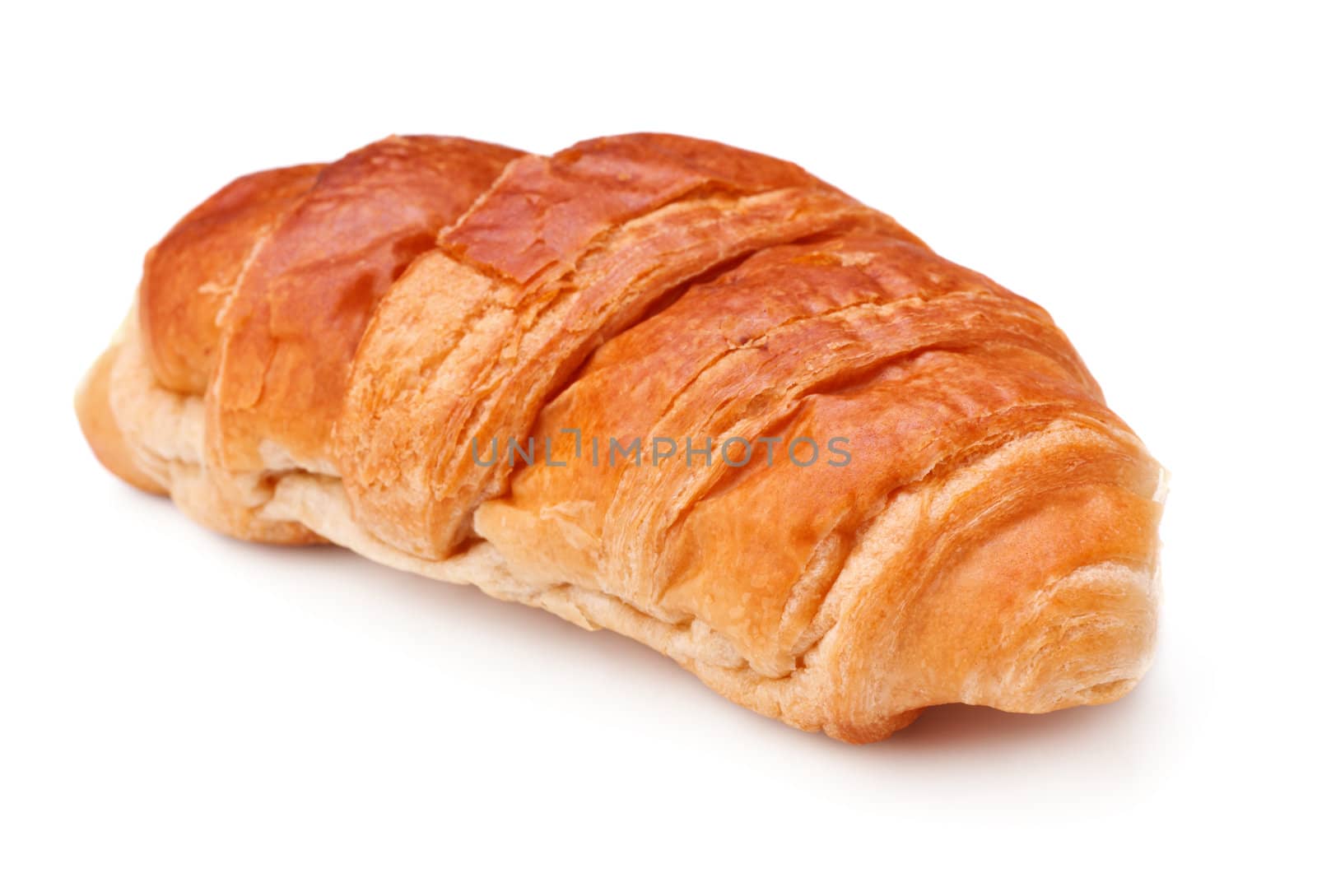 single fresh croissant isolated on white background