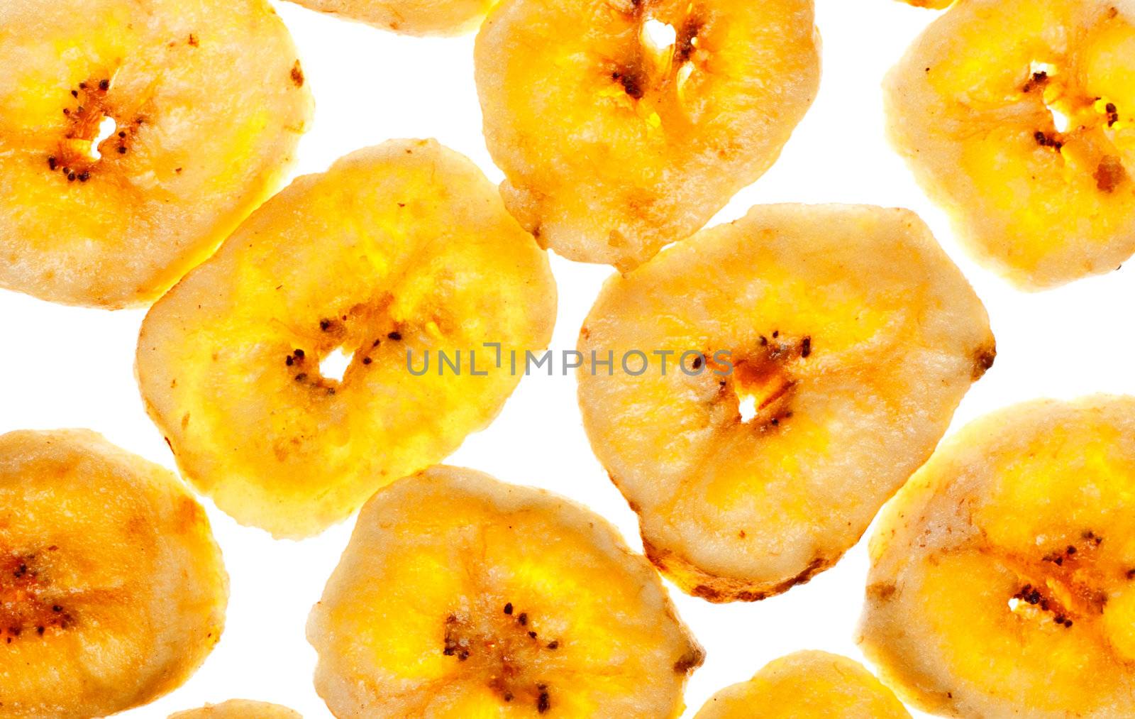 dried banana yellow sliced chips, horizontal background