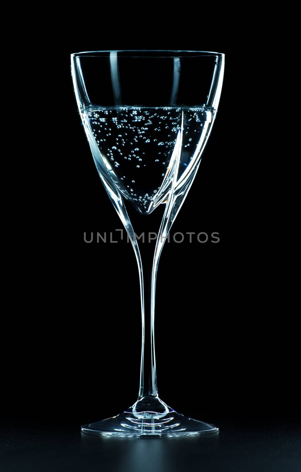 mineral water glass isolated on black background