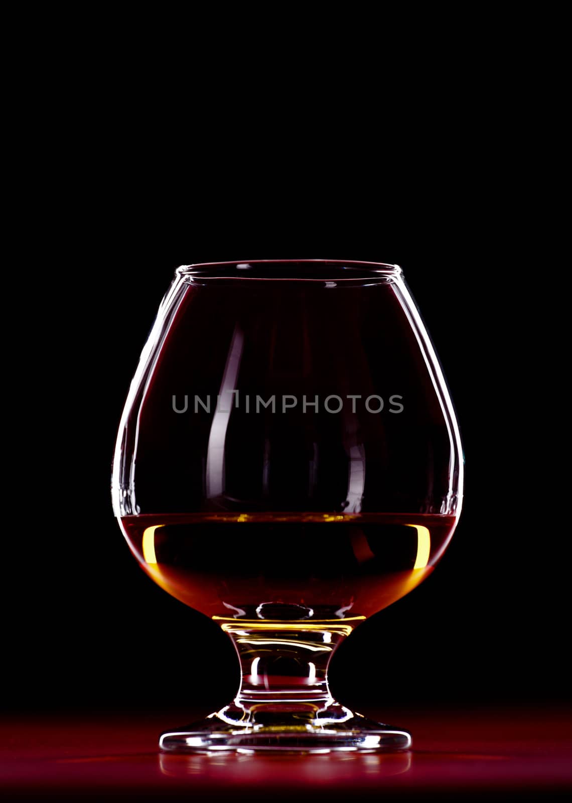 elegant whiskey glass isolated on black background