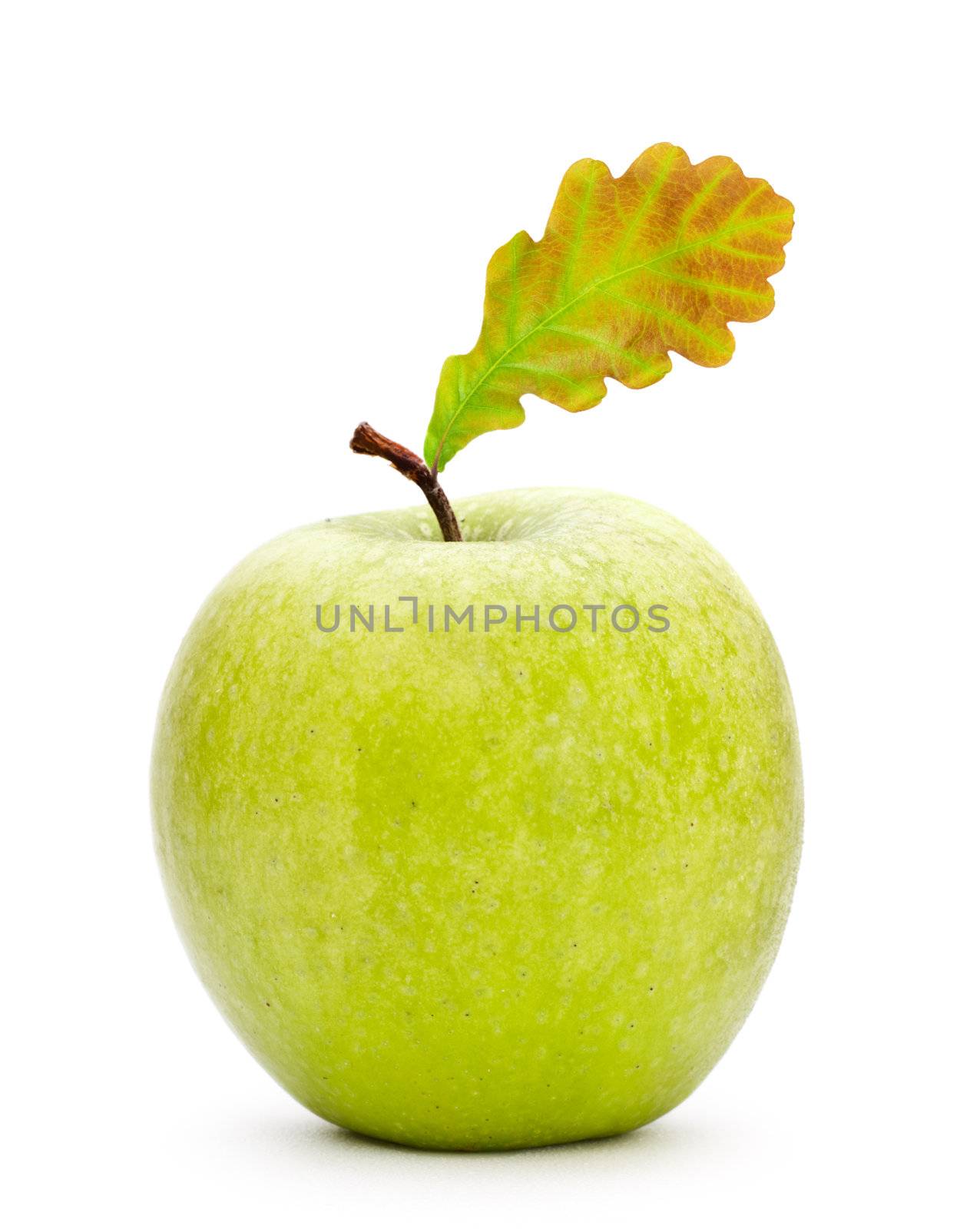 green apple with oak leaf isolated on white