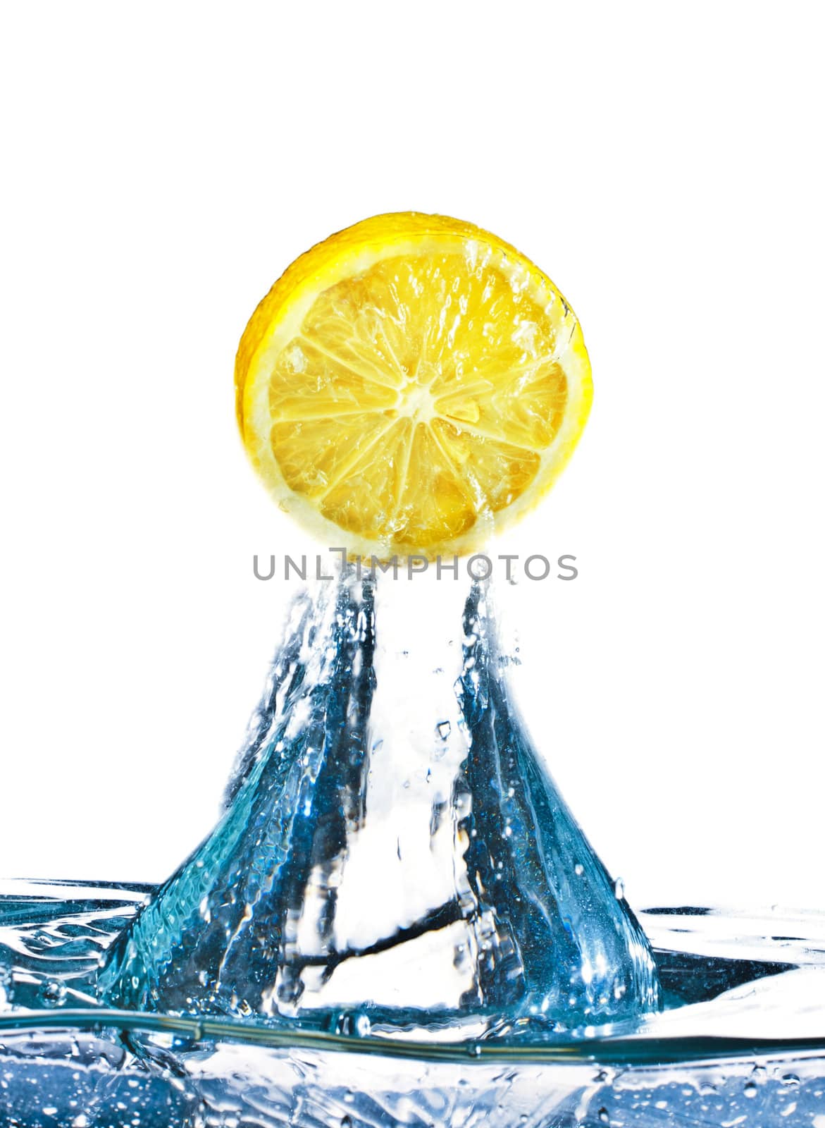 lemon is dropped into water splash isolated on white