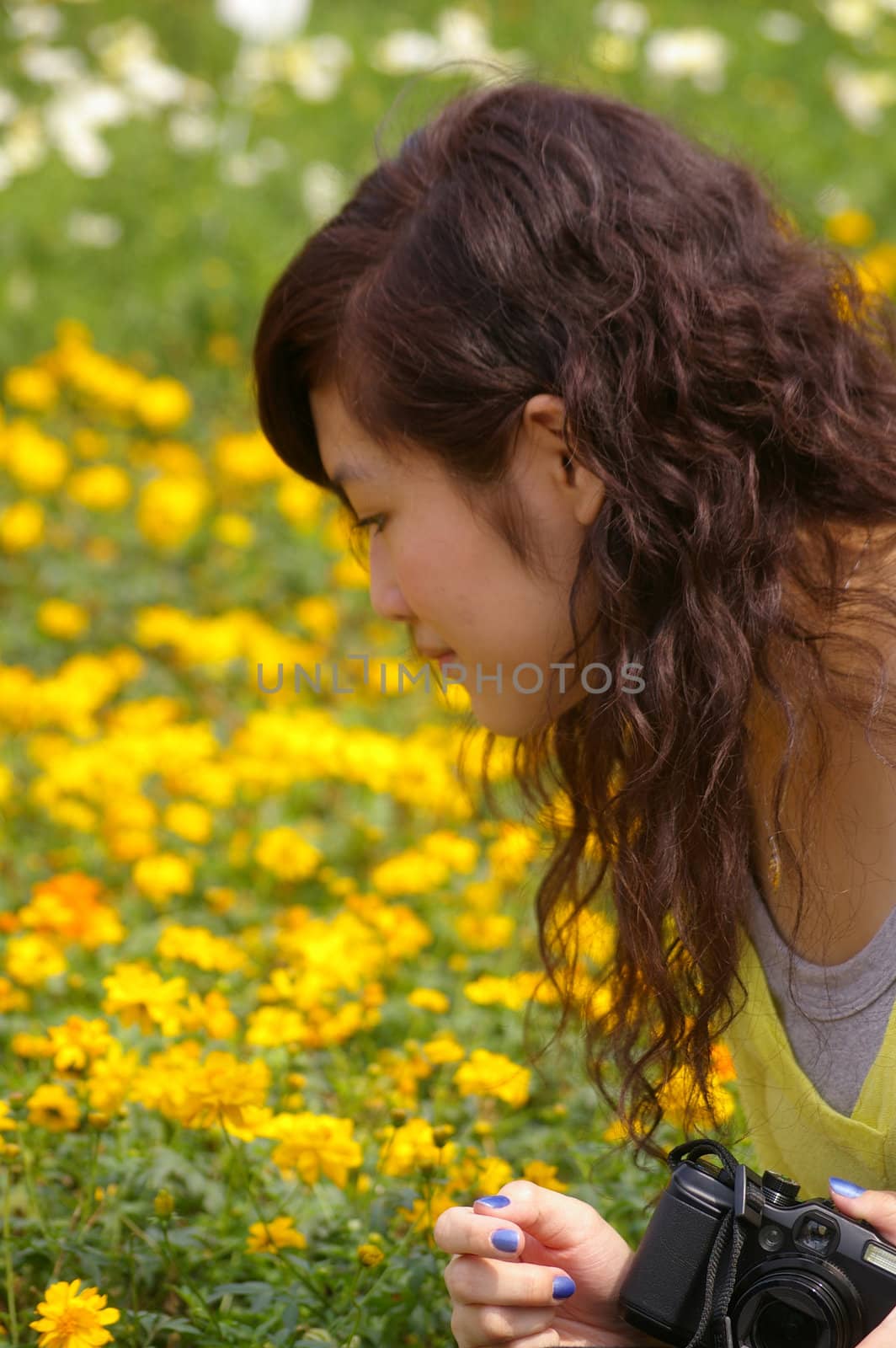 Asian woman looking flowers