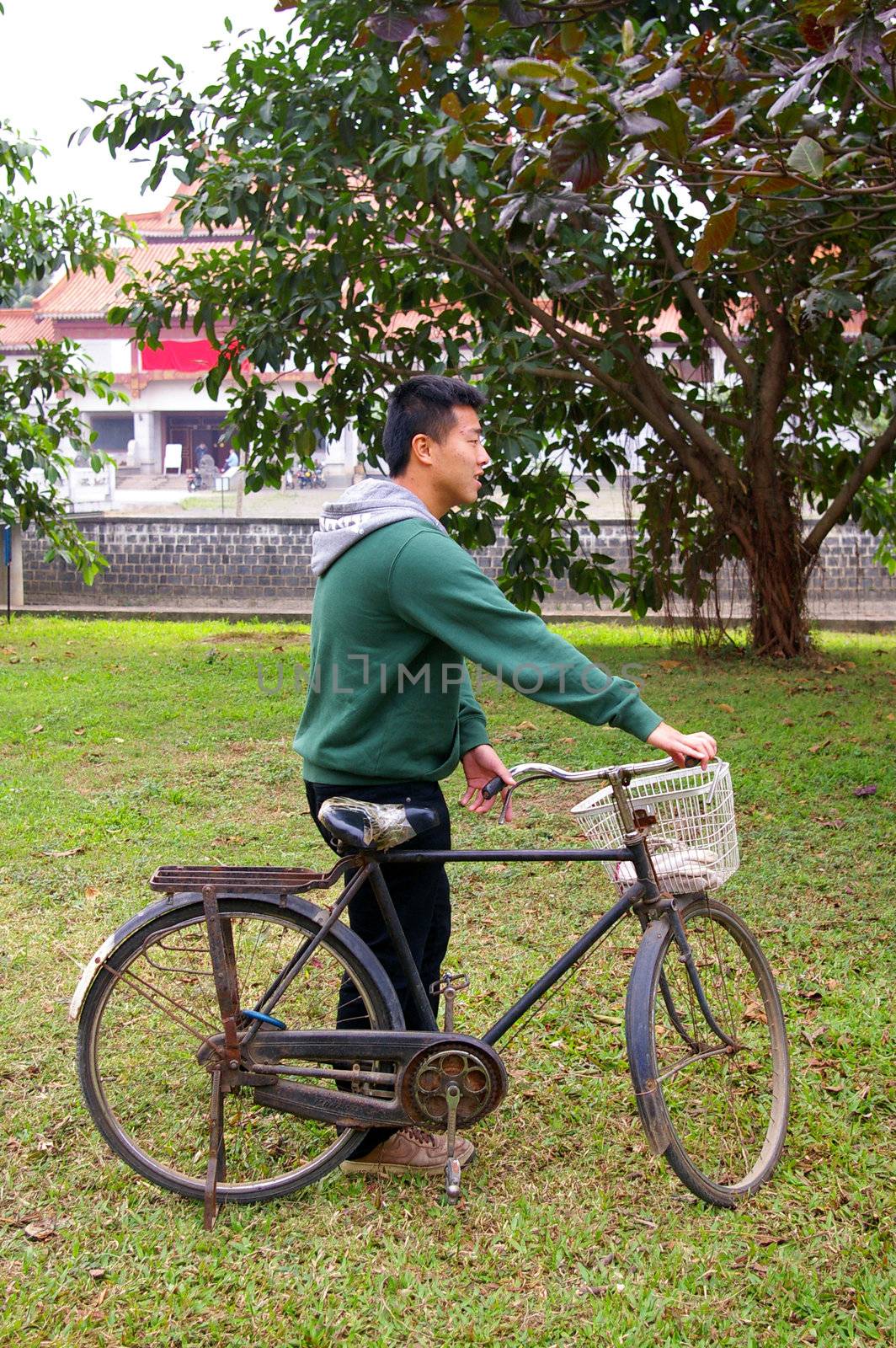 Asian man riding bicycle by kawing921
