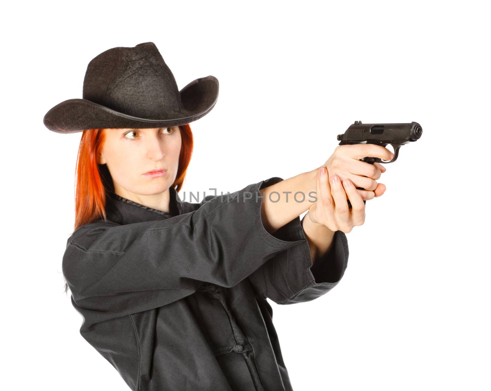 woman in black kimono aims with gun, isolated on white