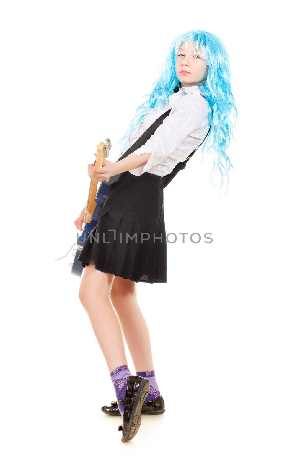 teen girl playing on a guitar, isolated on white