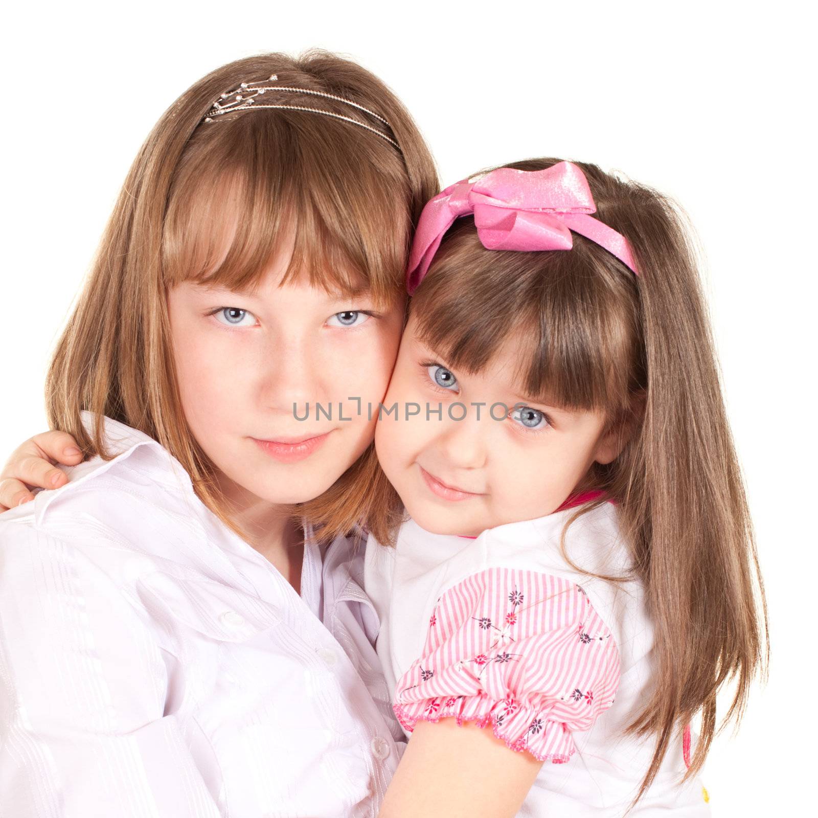 cute little sisters portrait, close up, isolated on white