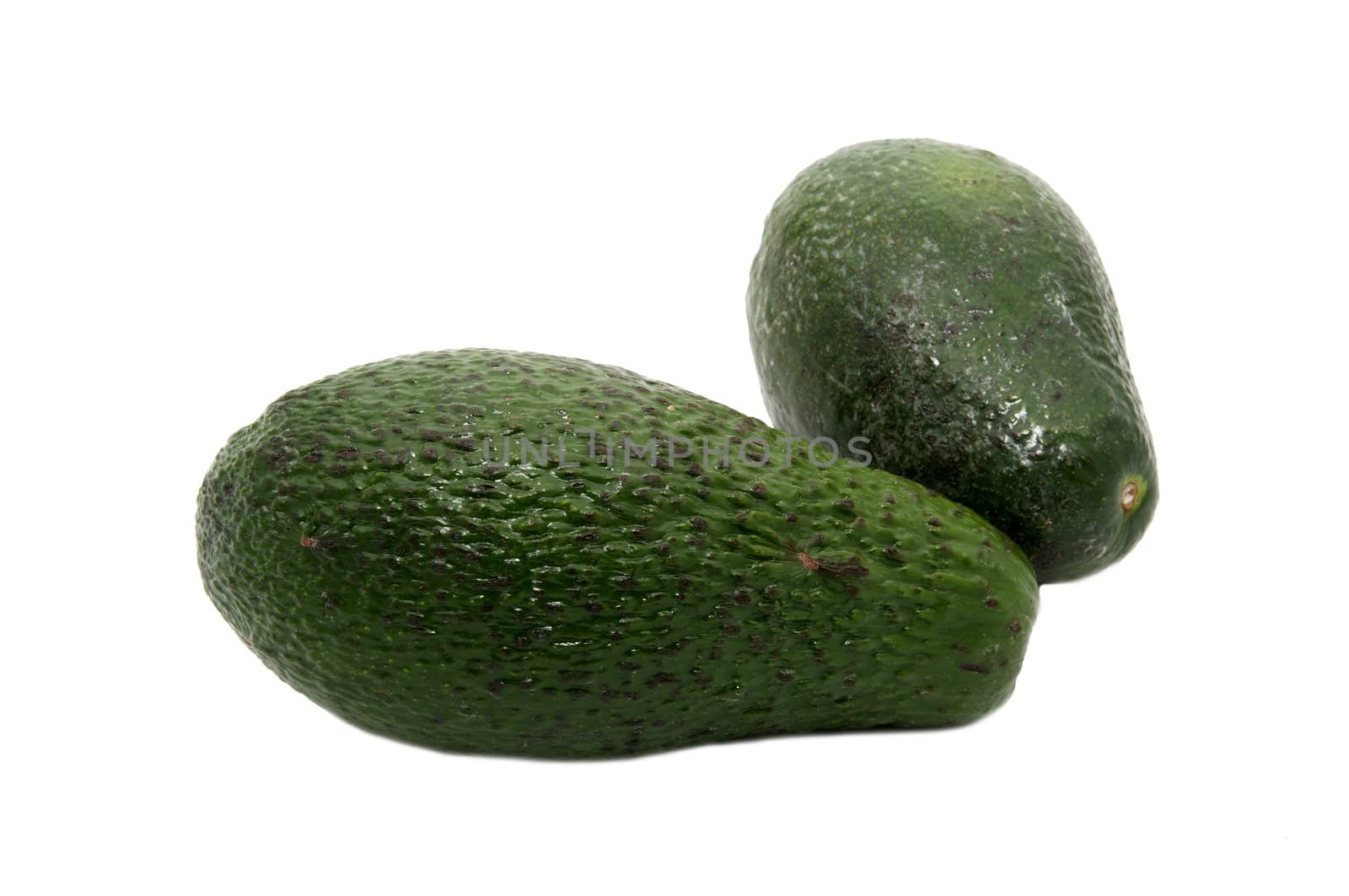 two pieces of fruit ripe avocado on a white background