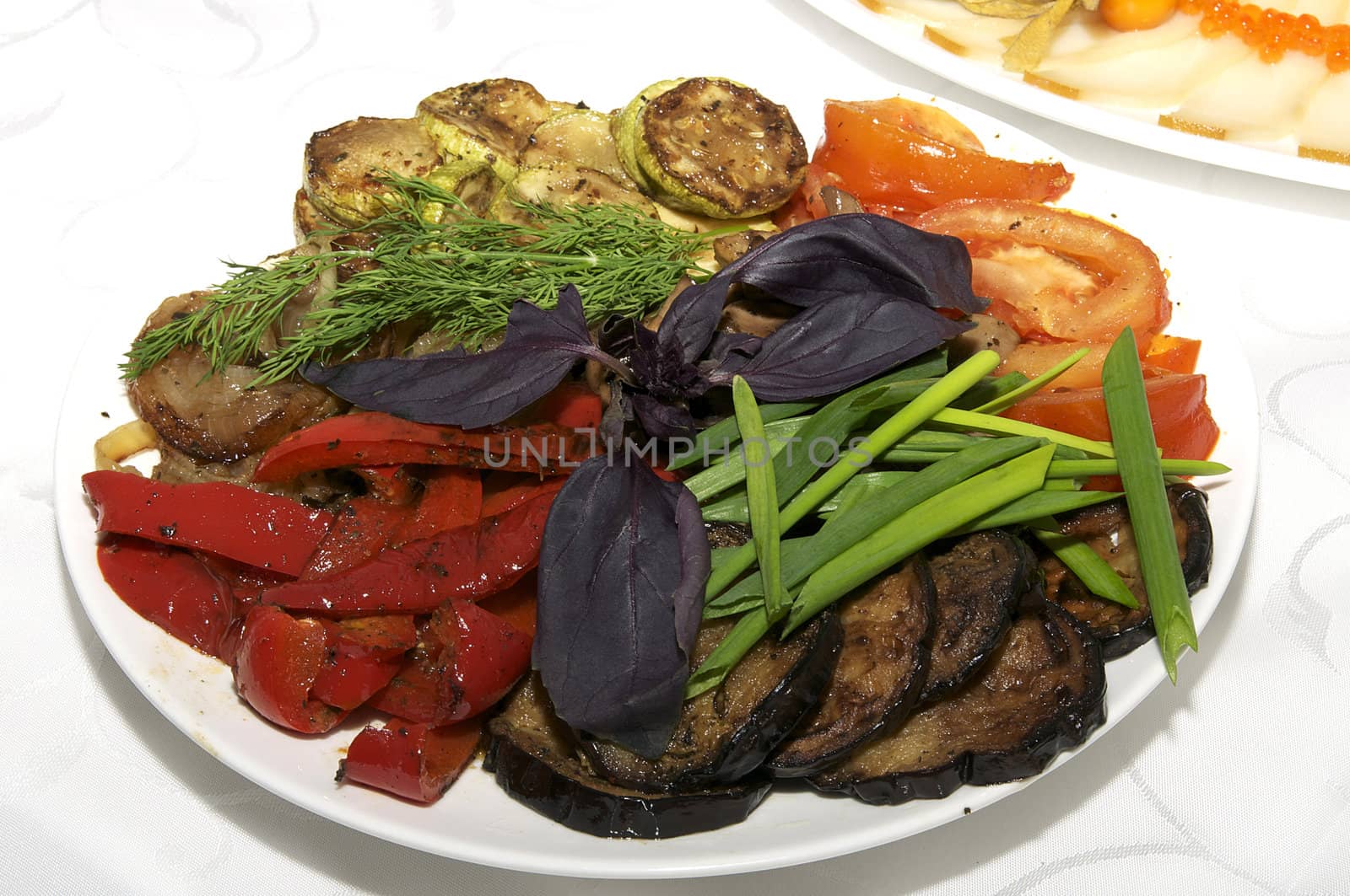 a plate of grilled vegetables on the holiday table