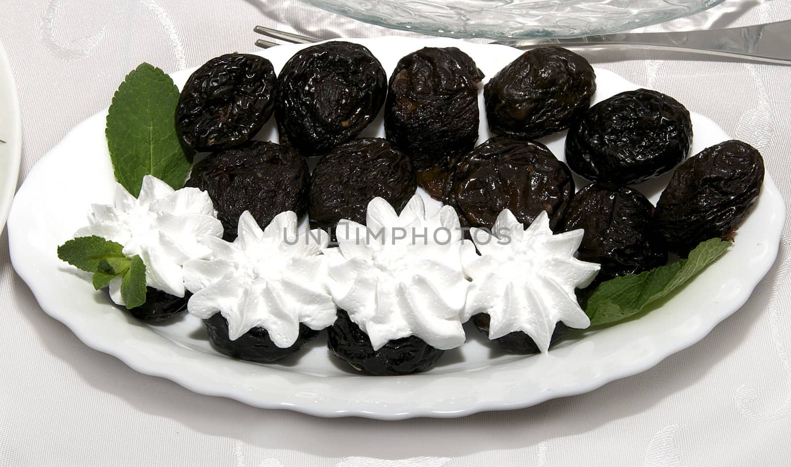 prunes and marshmallow cream on a plate on the table