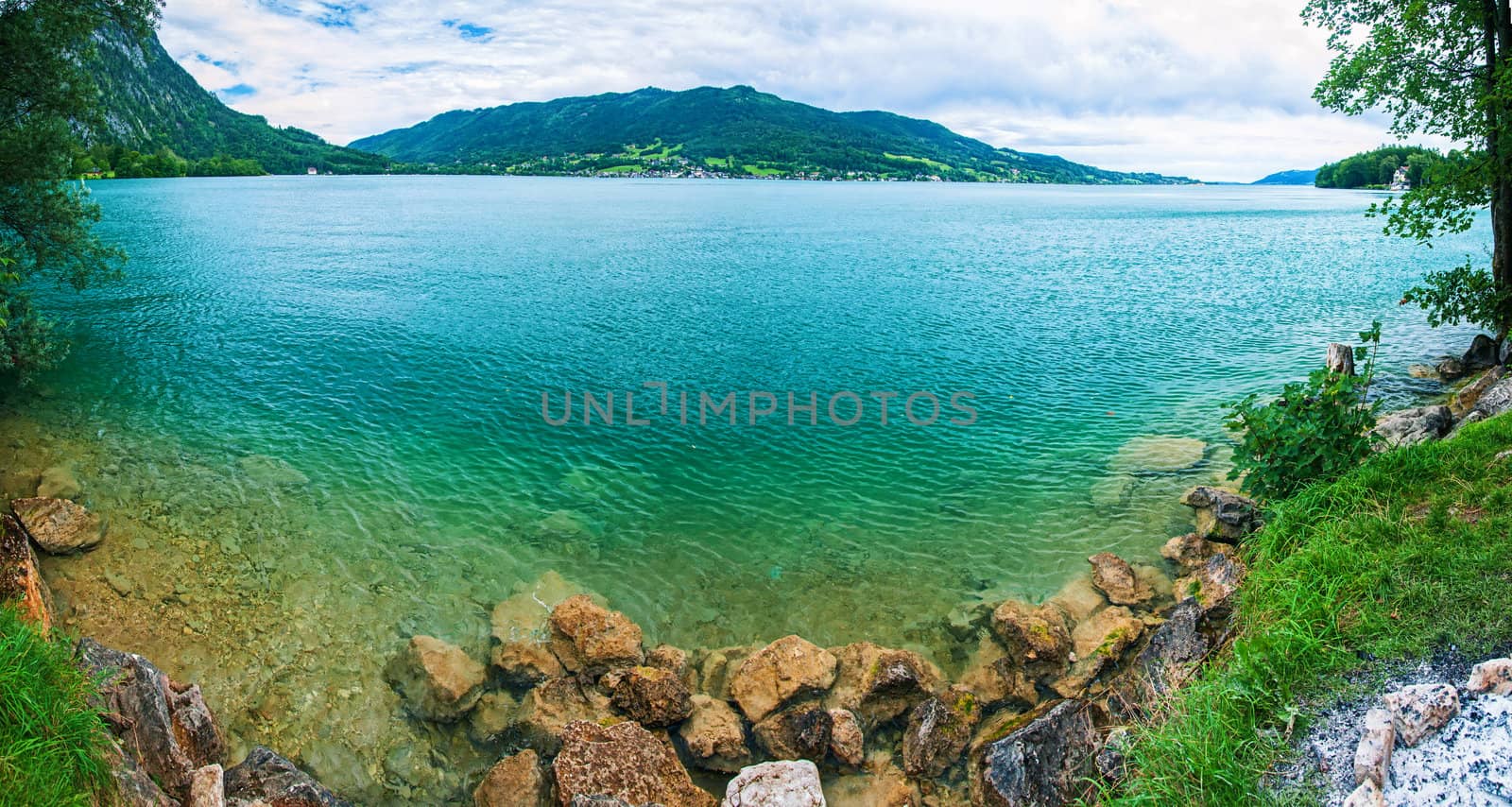Panorama a blue transparent alpine lake. Salzkammergut. Austria