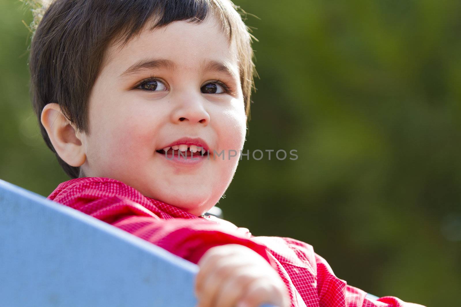 Cute little european baby boy playing at park by FernandoCortes