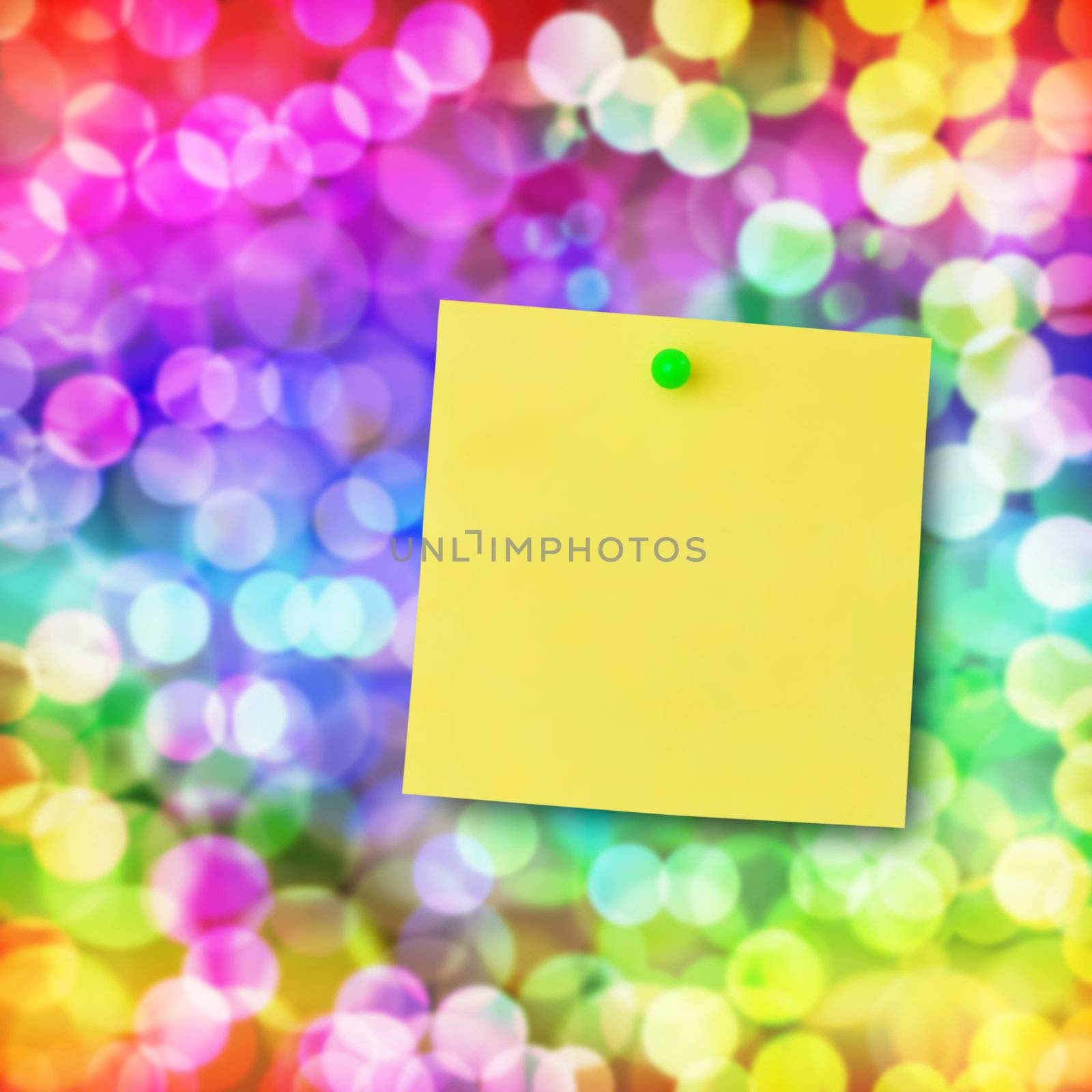 Sticky note on glowing colorful magical neon light background.
