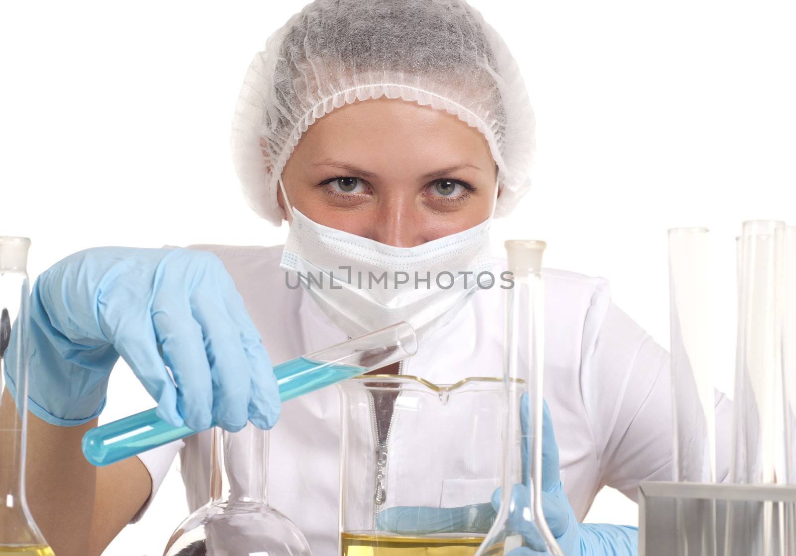 young woman scientist  chemist mixes the liquid in the tubes