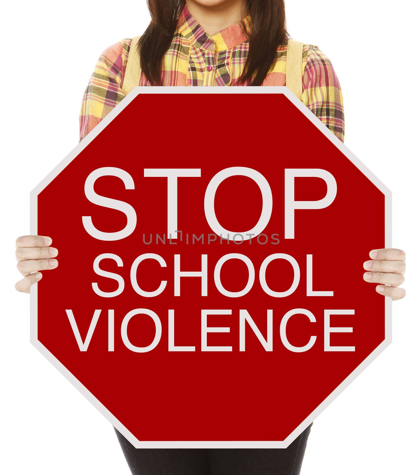 A student holding a conceptual stop sign on school violence