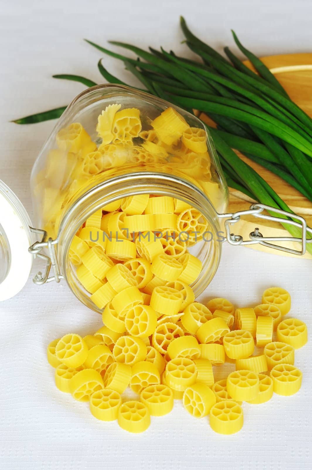An image of bright yellow pasta in a jar