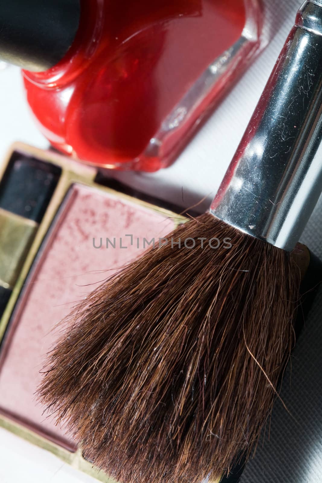 Cosmetic theme: an image of a brush and blush