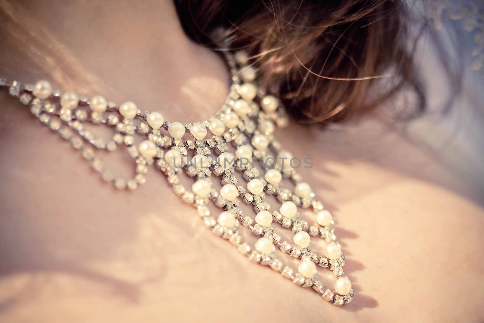 necklace from pearls on the neck of bride