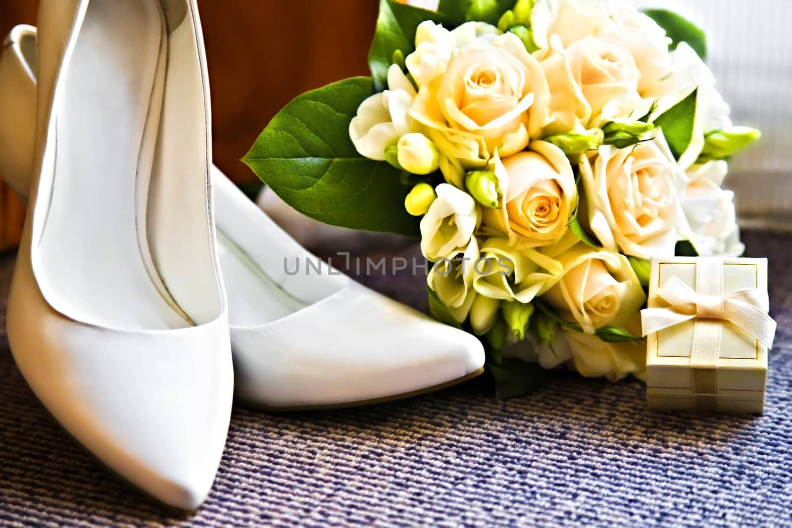 box with a wedding rings with bouquet and high heel shoes by zhu_zhu