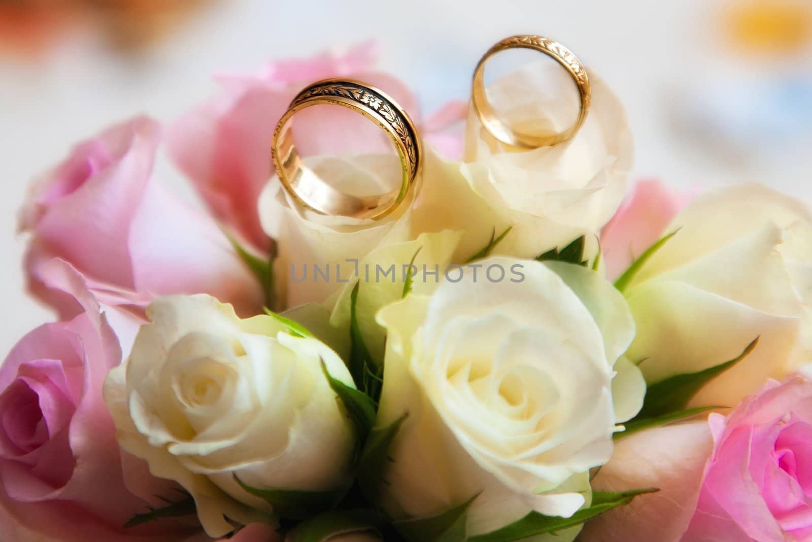 wedding rings with bouquet