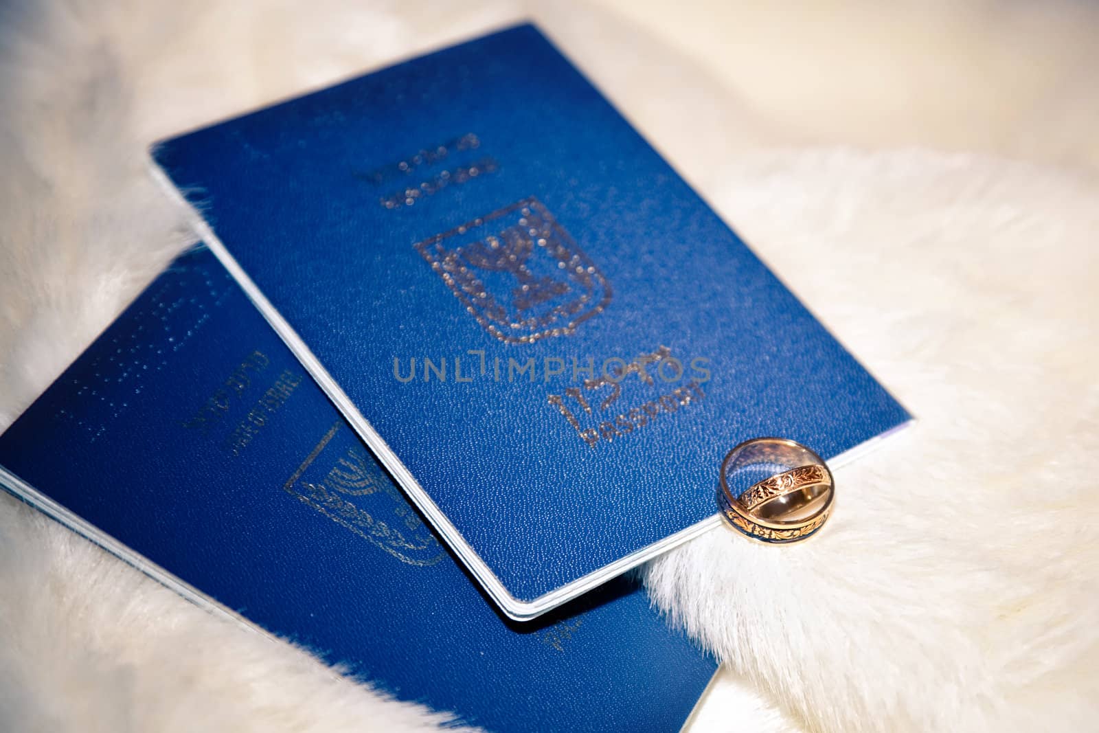 wedding rings and passports of Israel on boa
