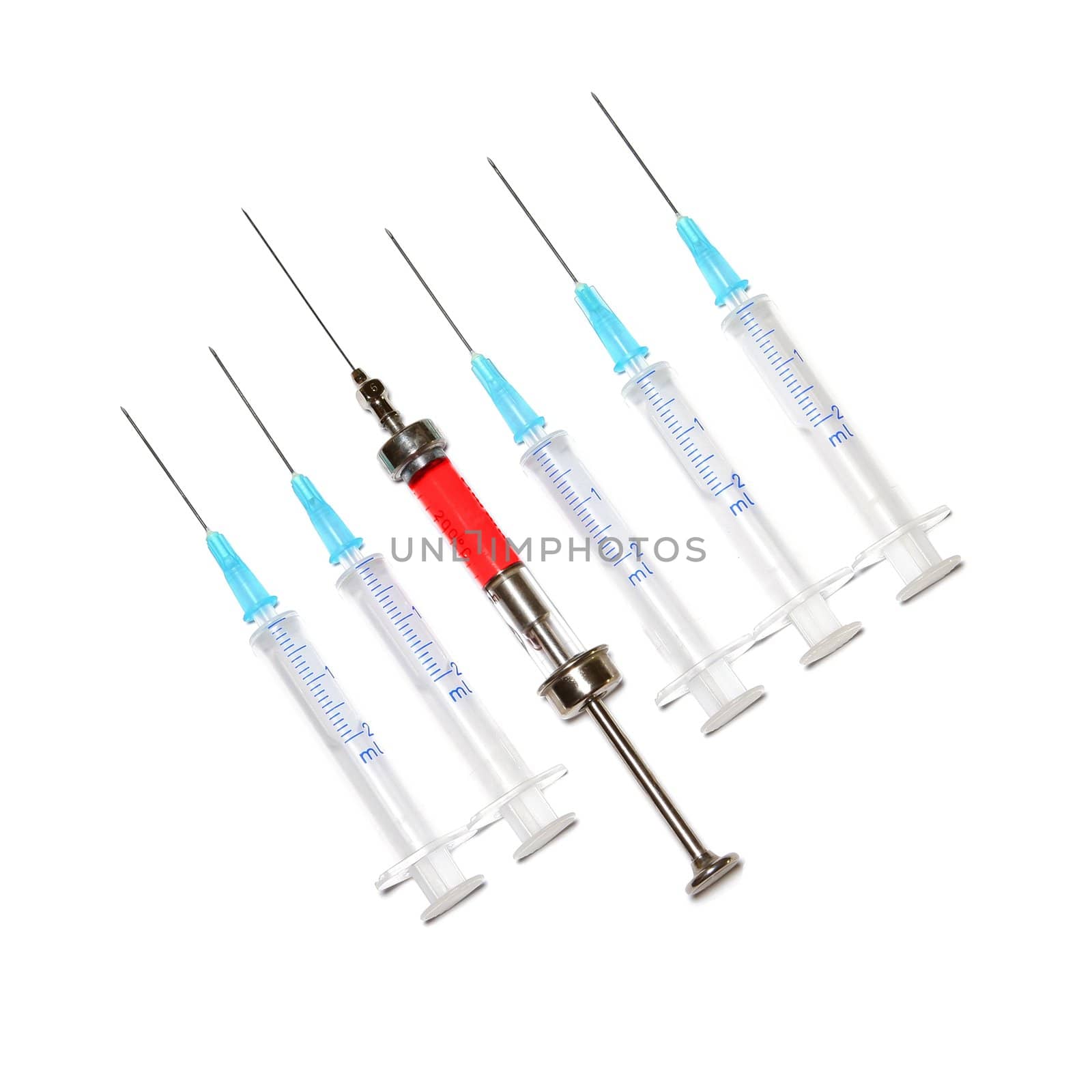 six syringes in row on white background