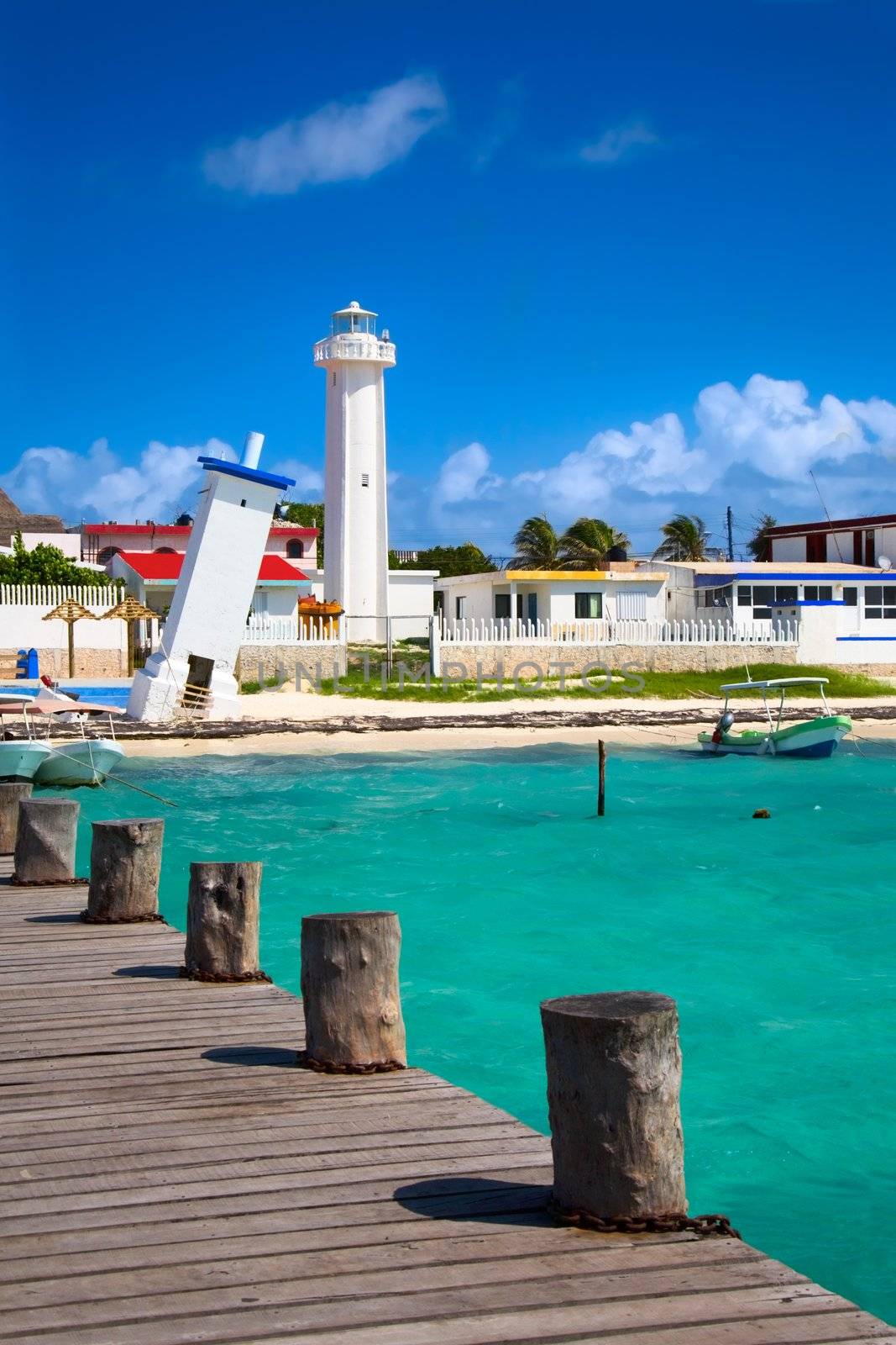 old tilted and new lighthouses in Puerto Morelos near Cancun, Quintana Roo, Mexico