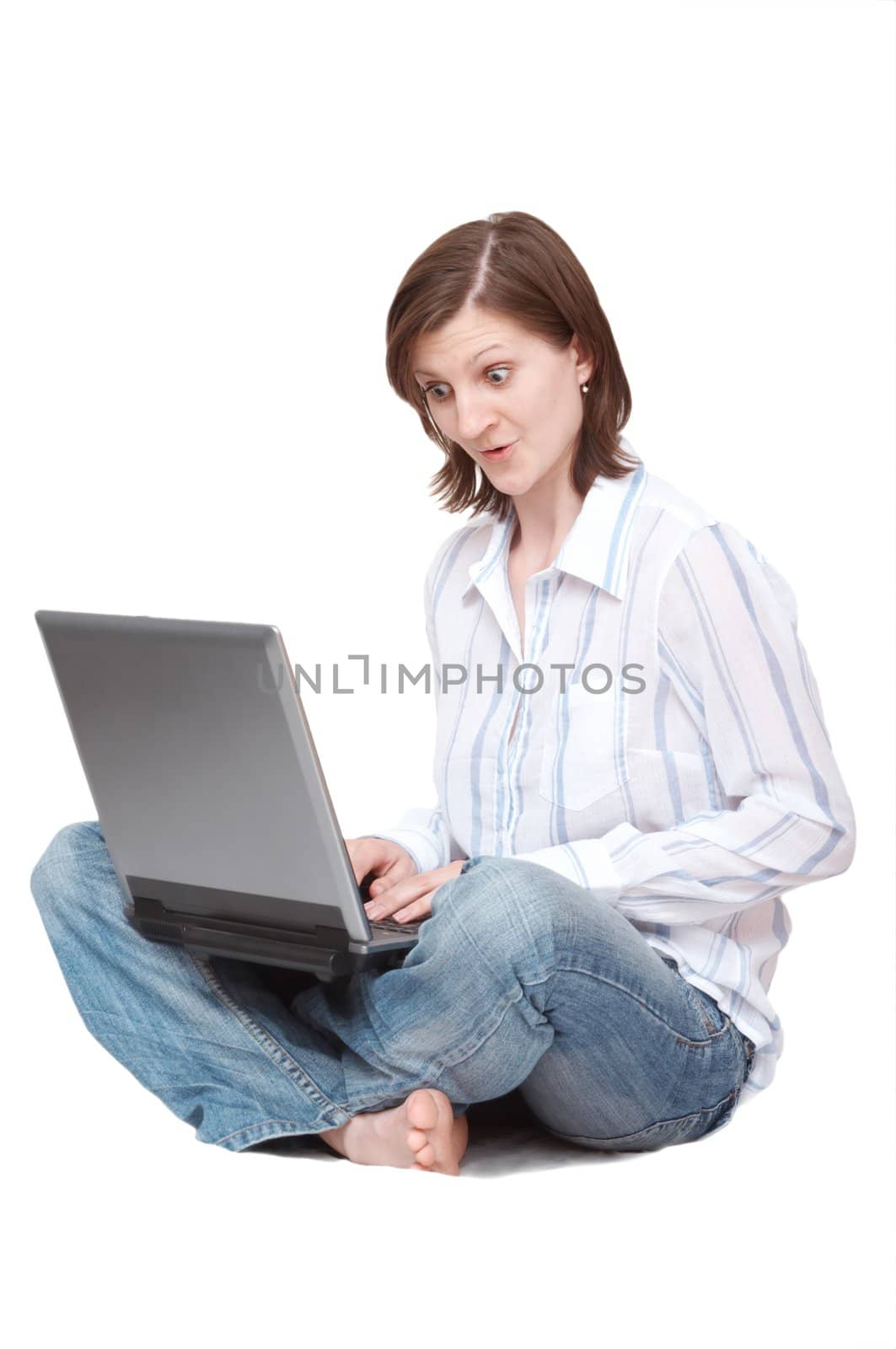 woman with notebook sitting on the floor