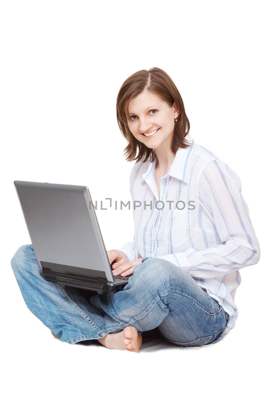 woman with notebook sitting on the floor