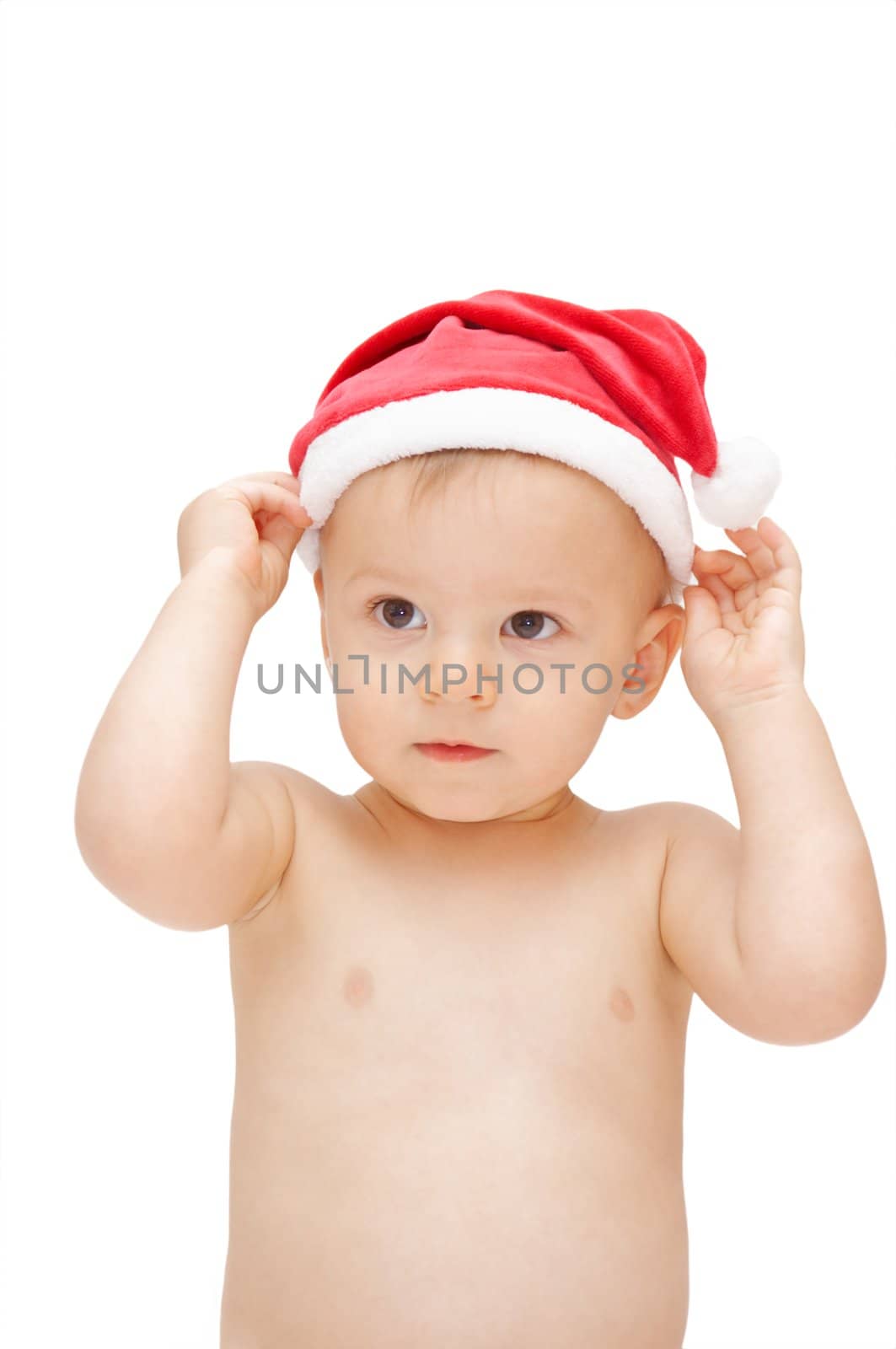 baby wearing santa claus cap