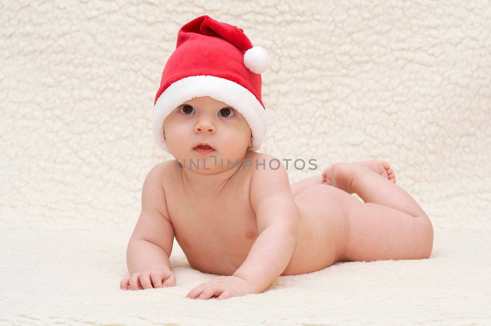 baby in santa claus cap