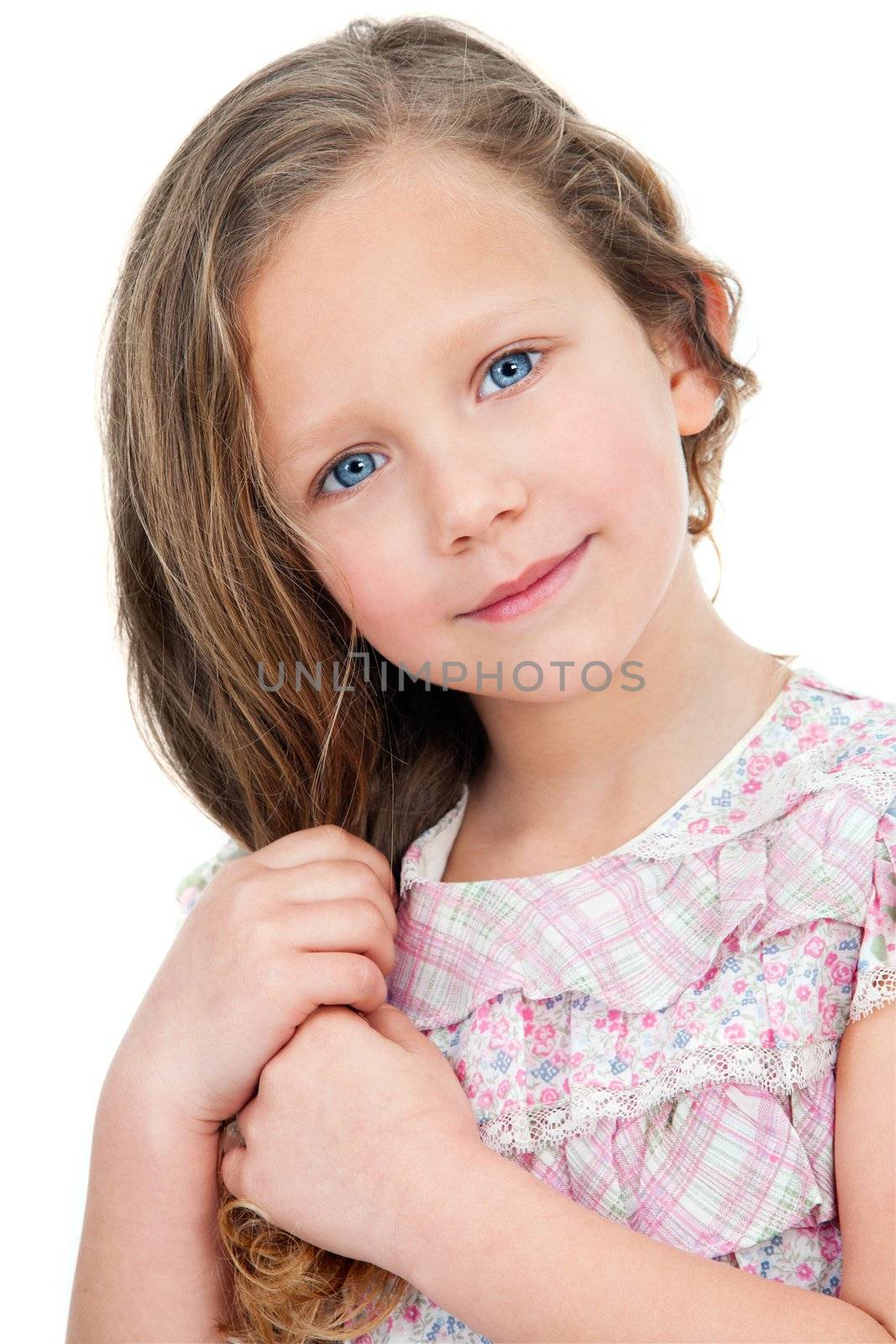 Close up Portrait of cute little girl with innocent look. Isolated on white background.