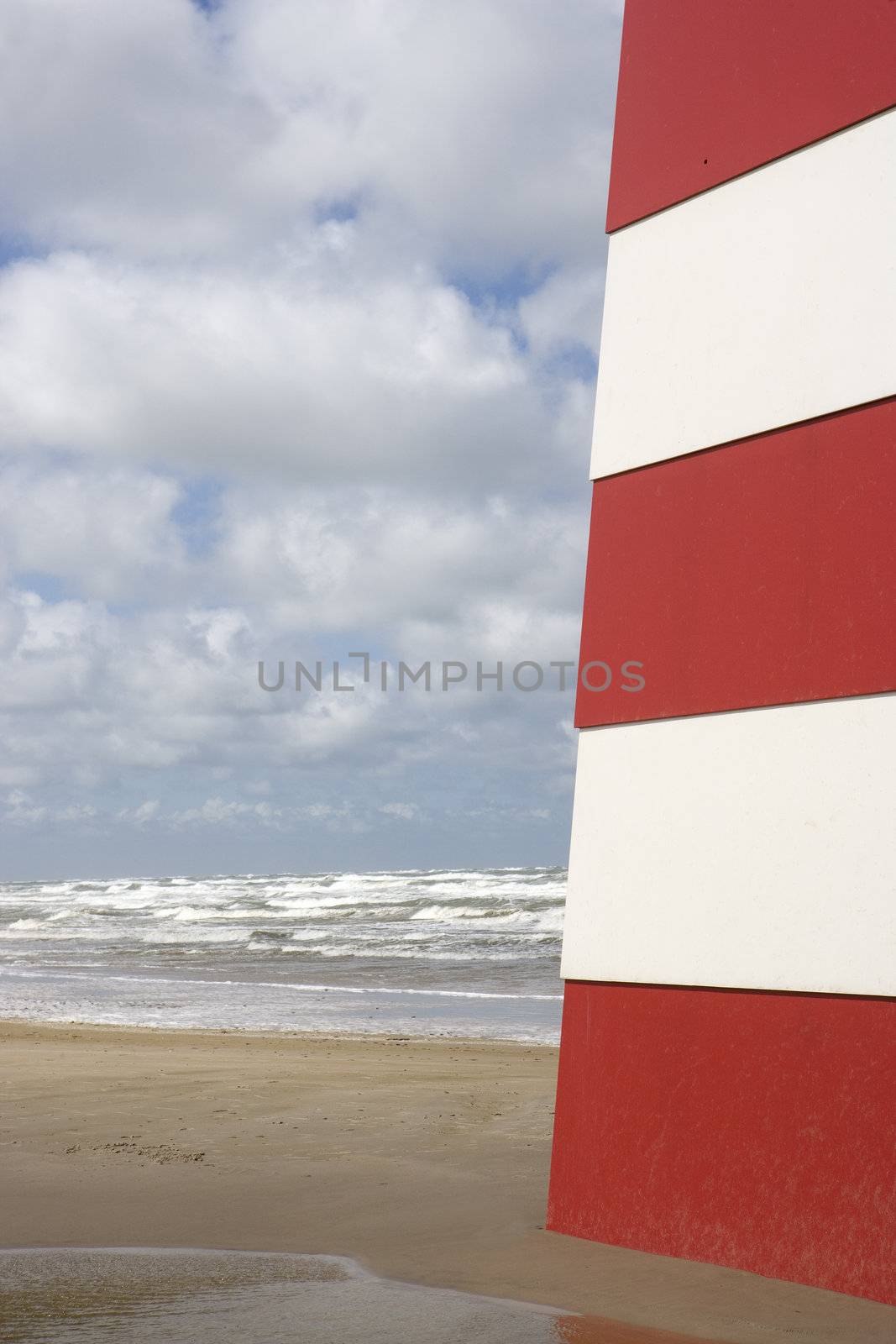 Red and White Landmark on the beach