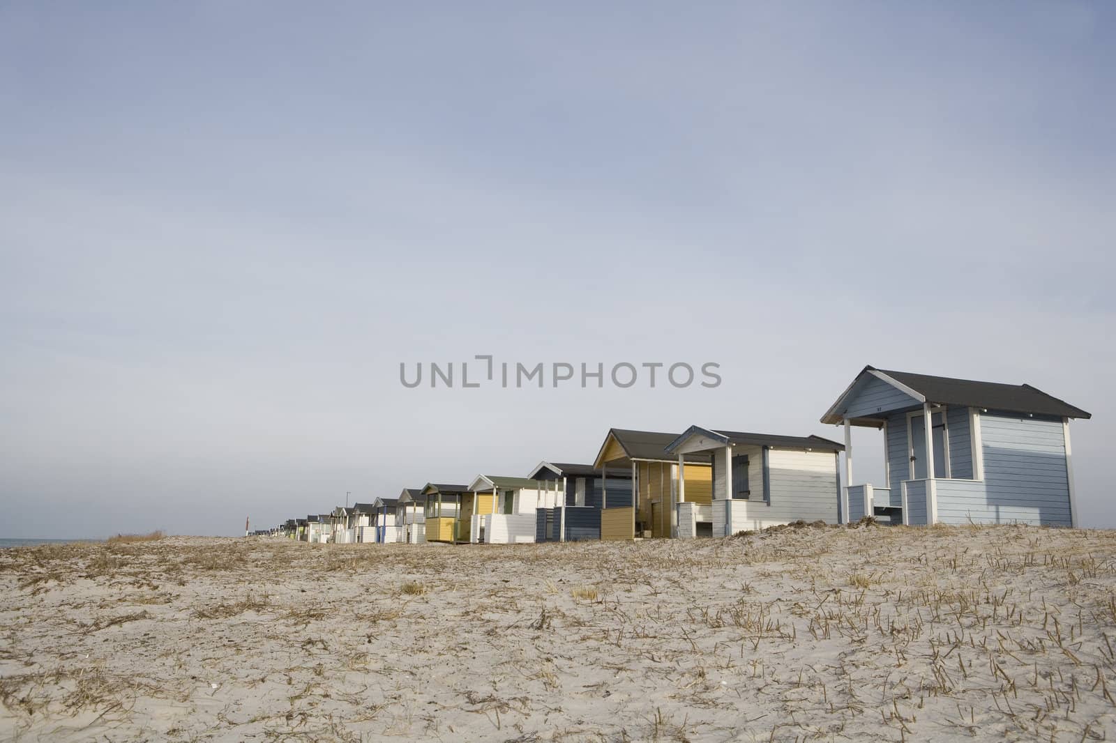 Beach Huts in a row close to water