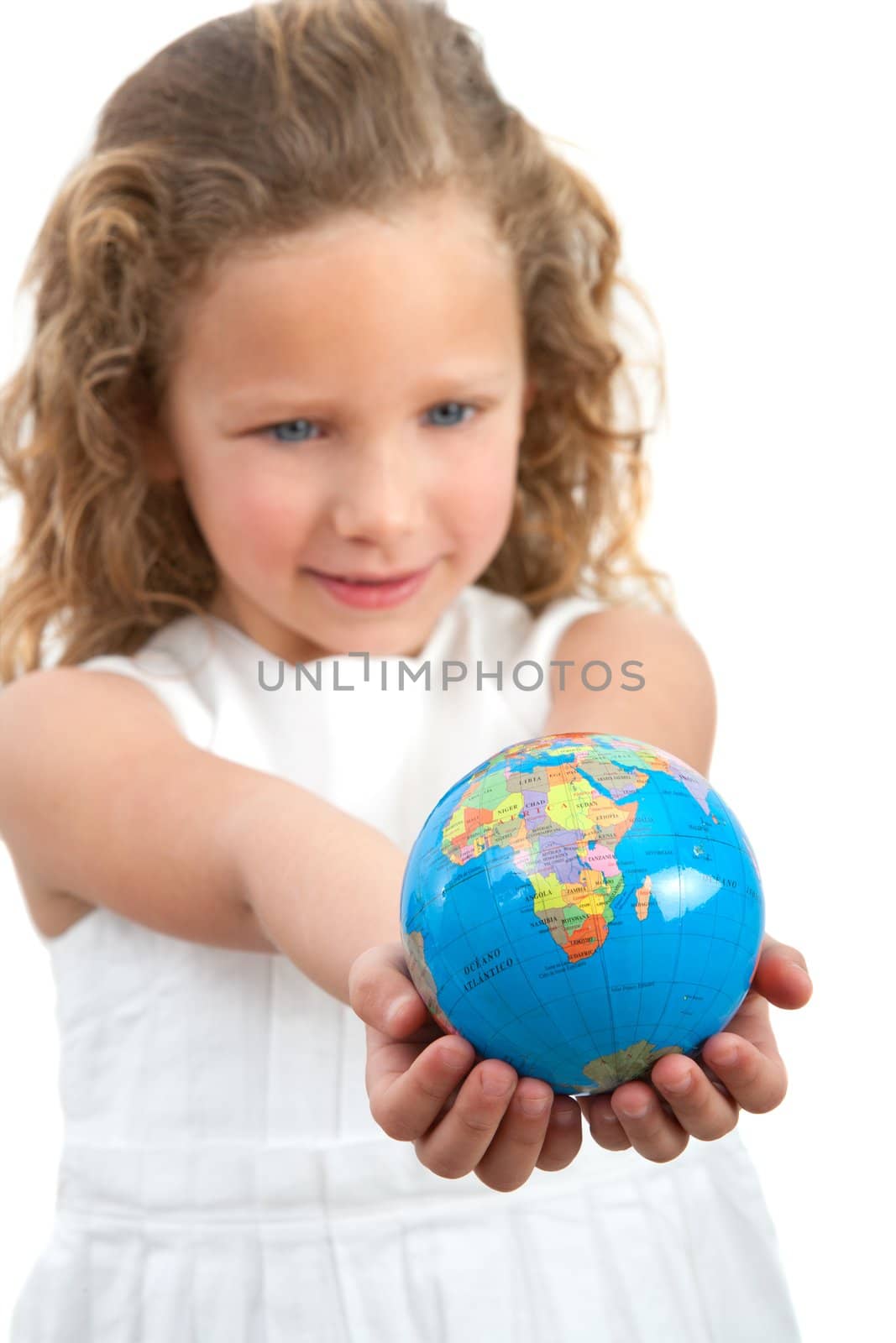 Close up of cute little girl looking at earth sphere.Focus piont on earth.Isolated on white background.