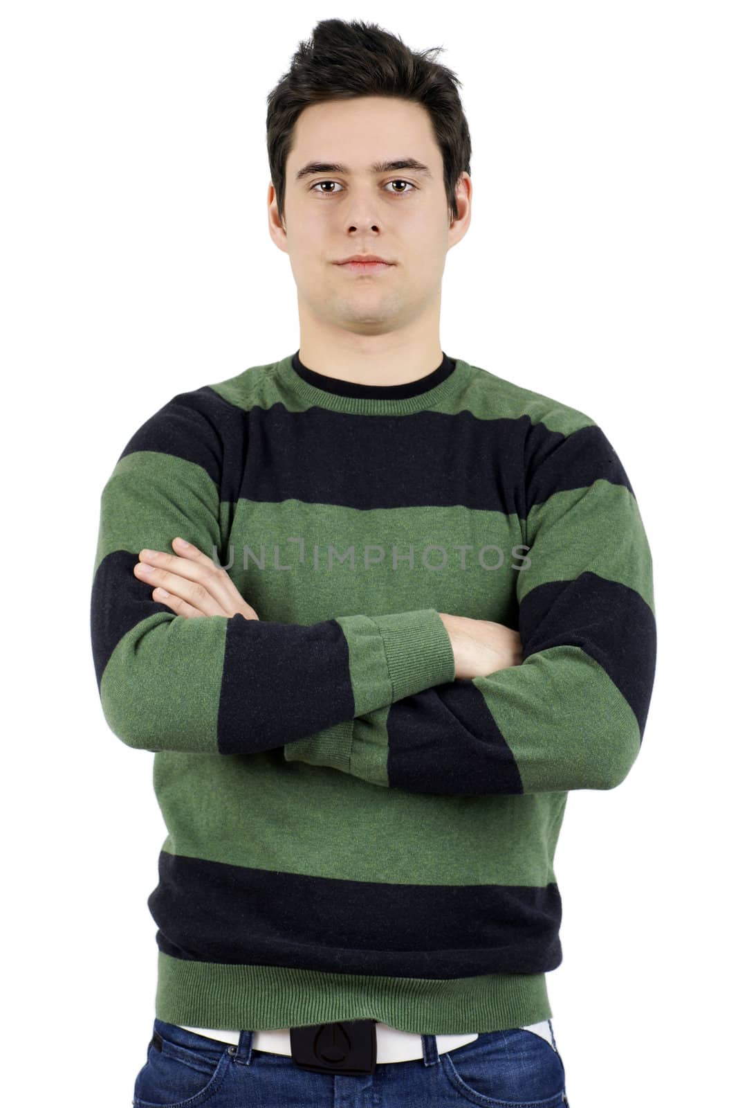 Handsome confident but serious young man or student looking at camera with arms crossed.