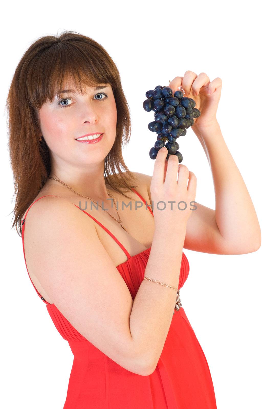 beautiful girl with black grapes in hand isolated on white