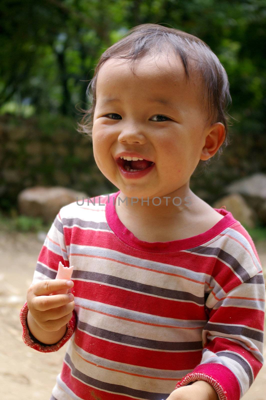 CHINA - MAY 17, A traditional Chinese young girl is smiling on Yangshuo, China on 17 May, 2010.