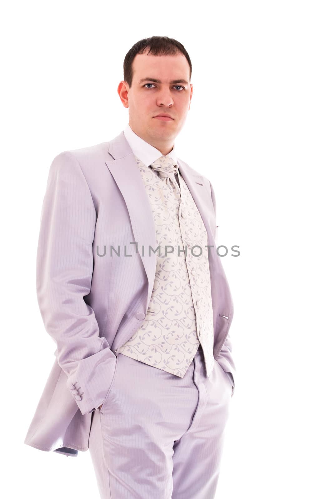 attractive young man in wedding suit isolated on white