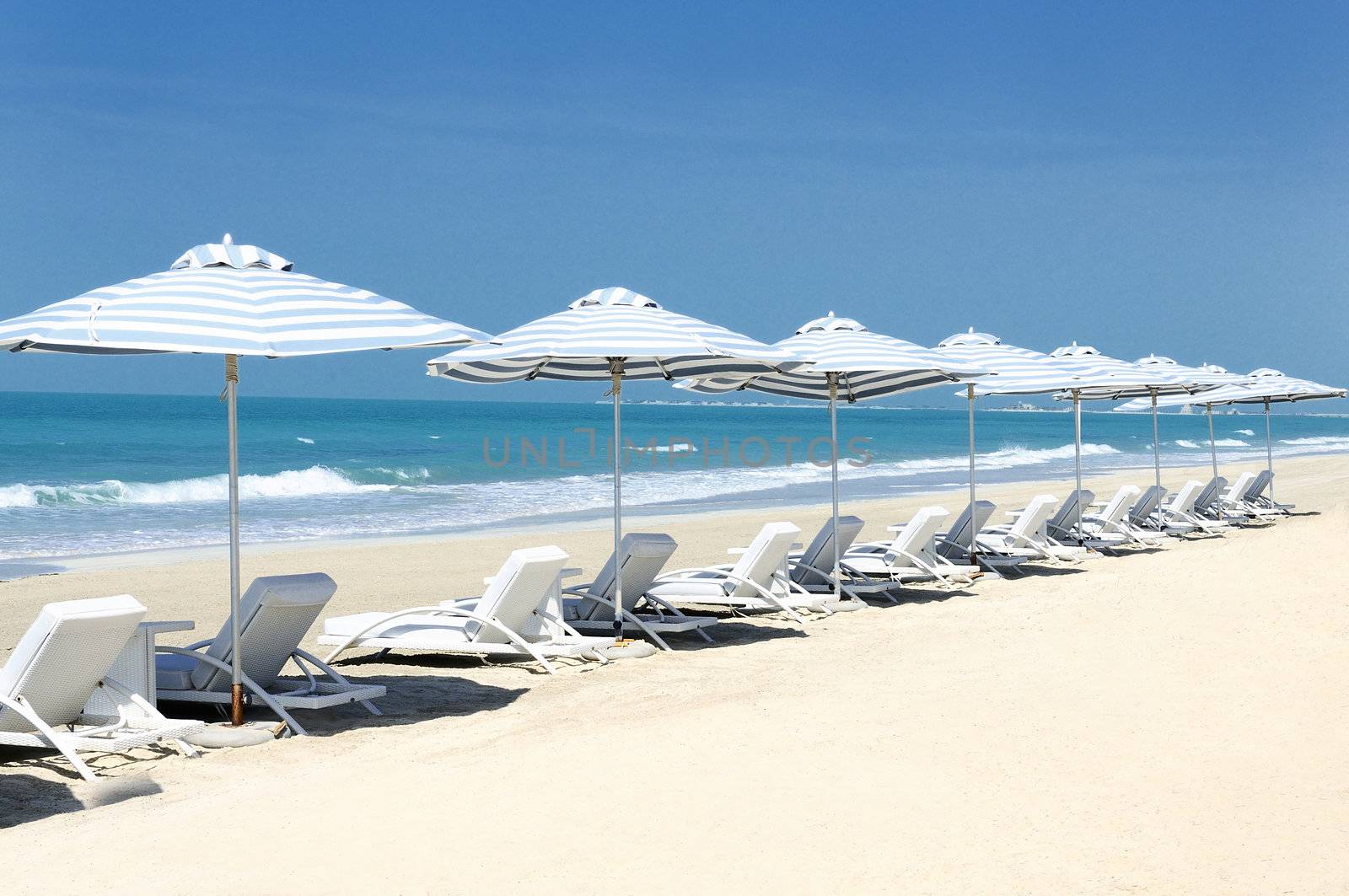 Panoramic view of chairs and nices umbrella on the beach